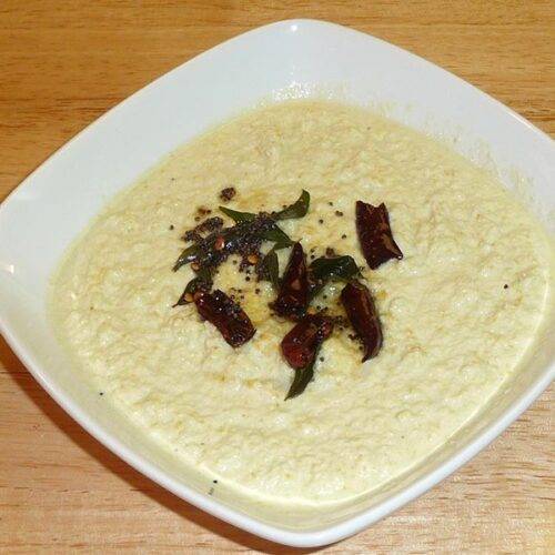 A bowl of creamy Coconut Chutney with fresh coconut and spices