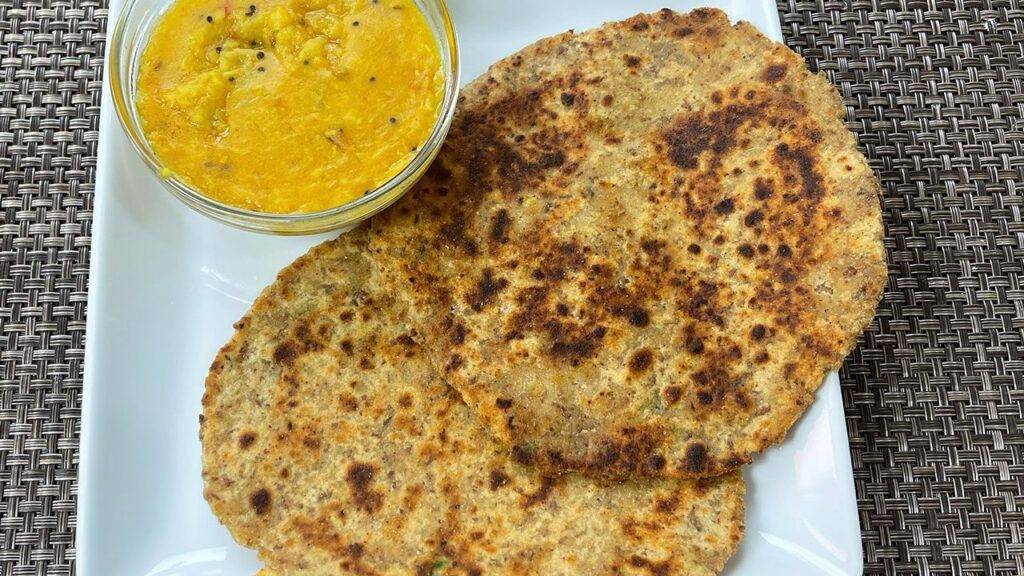A plate of Missa Paratha served with chutney