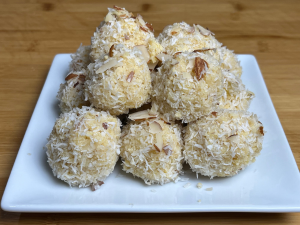 Delicious Pineapple Coconut Ladoo garnished with shredded coconut