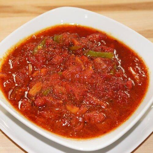 A bowl of homemade Rhubarb Chutney with fresh ingredients"